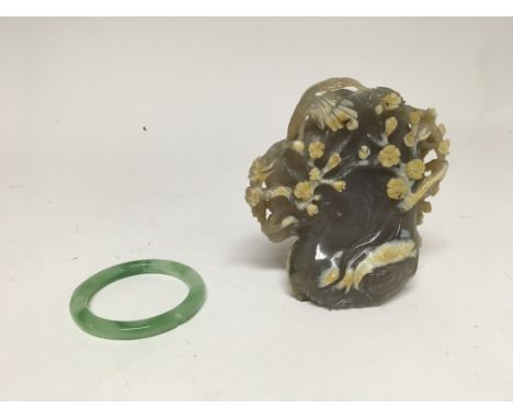 A pair of Oriental items to include a Jade bangle and interesting possibly Jade carving, possibly of a koi pond scene. Bangle