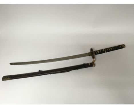 A reproduction Japanese katana sword, with scabbard and inscribed blade.