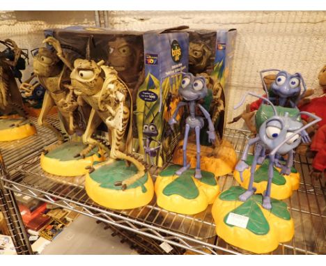 Collection of animated battery powered Bugs Life figurines including Flik and Hopper 