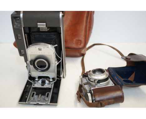 Polaroid model 150 vintage camera together with a Paxina camera 