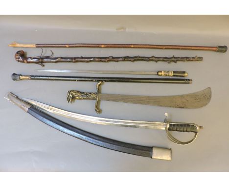 An early 20th century Indian sword stick, decorative cavalry sword and short sword, and two walking sticks