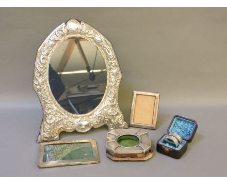 Silver items, including a modern easel frame by R C, Sheffield 1992, two small photo frames, a watch holder, Birmingham 1966,