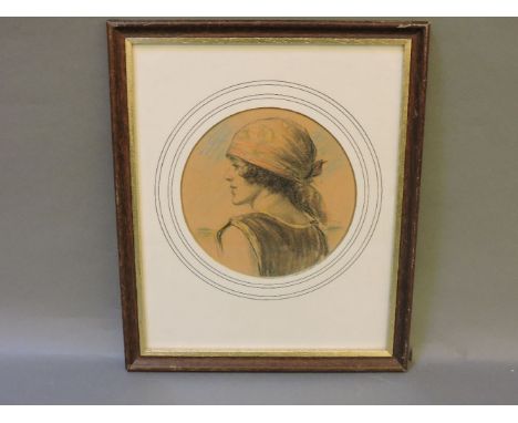 English School, circa 1920A PORTRAIT OF A GIRL WEARING A SCARFSigned with initials, coloured chalks, circular16cm