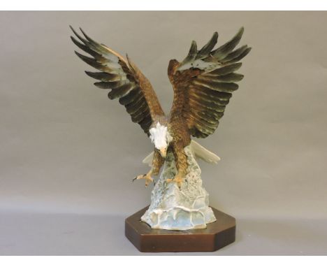 A large Kaiser porcelain model of a bald eagle, being a limited edition No 497/800, on wood plinth