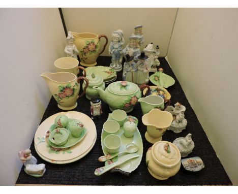 A collection of pottery items, including Clarice Cliff dish, Victorian figures, etc