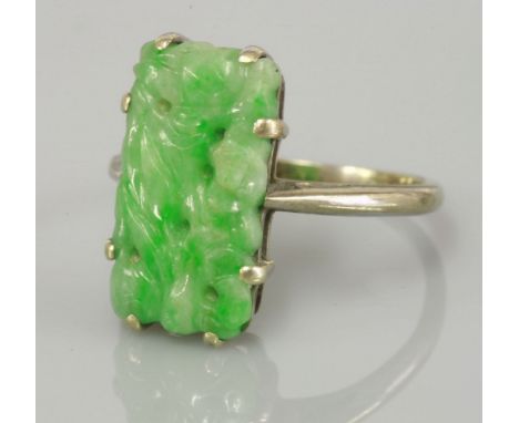 A carved jade plaque ring, tested as approximately 9ct white gold