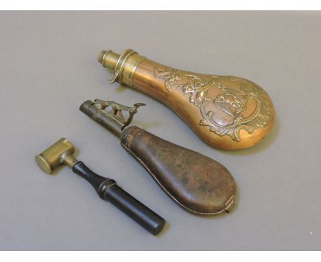 A copper powder flask, with American eagle decoration, a leather shot flask, and a powder measure with ebony handle