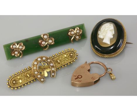 An Etruscan style split pearl gold bar brooch, marked 15ct, a nephrite jade split pearl gold bar brooch marked 9ct, a gold ca