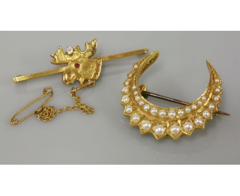 A gold split pearl crescent brooch, circa 1900, marked 18, and a 9ct gold ruby and diamond set elk or moose bar brooch or tie