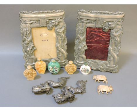 A pair of Japanese metal easel photo frames, with relief dragons on arches, 24cm high, and various further Oriental items, fi
