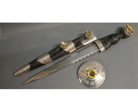 A Scottish Silver Mounted Dress Dirk By WM Anderson, Edinburgh, the 28cm polished blade with scalloped backed edge, the scabb