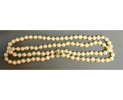 A Double Cultured Pearl Necklace With A 14ct. Gold Diamond Set Clasp 