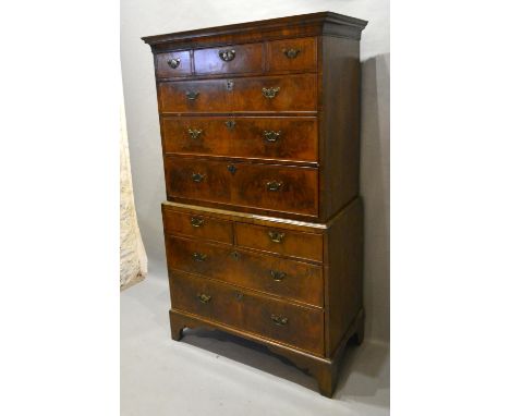 A Burr Walnut Chest On Chest The Moulded Cornice above three short and three long drawers, the lower section with two short a