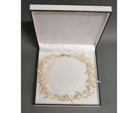 A Modern Fresh Water Pearl Necklace With Silver Clasp 