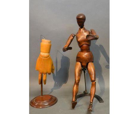 A 19th Century French Carved Wooden Artists Mannequin With Stand, together with a similar carved wooden model of a hand.  The