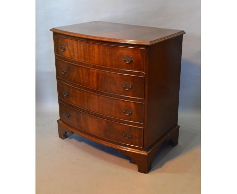 A Reproduction Mahogany Bow Fronted Chest The Moulded Top above four long drawers with metal handles, raised upon bracket fee