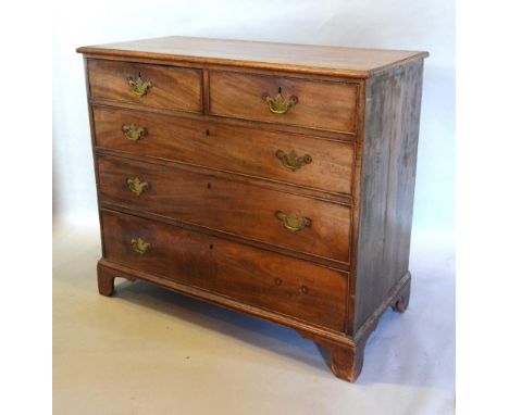 A George III Mahogany Chest The Moulded Top Above Two Short and three long drawers with brass handles and escutcheons, raised