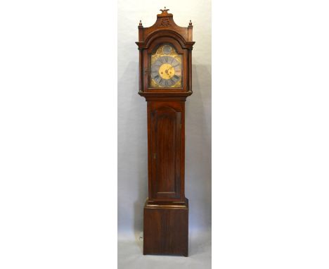 A George III Mahogany Longcase Clock The Arched Hood above a similar door and conforming plinth base, the brass dial inscribe