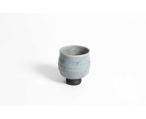 ARR John Wheeldon (born 1950) a raku light blue crackle glazed footed bowl, impressed W mark to base, 8cm x 7cmDusty to inter