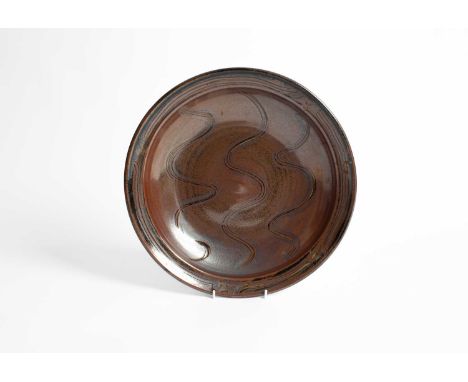 ARR Ray Finch (1914-2012) for Winchcombe Pottery, a stoneware platter with wavy line decoration to centre, 33.5cm wideProvena