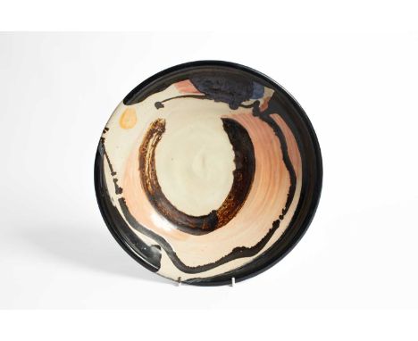 ARR Sandy Brown (born 1946) a pottery charger decorated polychrome abstract design, painted signature, 34cm diameterIn good c