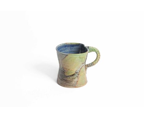 ARR
Jane Hamlyn MBE (born 1940) a green and brown glazed mug, impressed maker's mark, 10cm high

In good condition - no damag