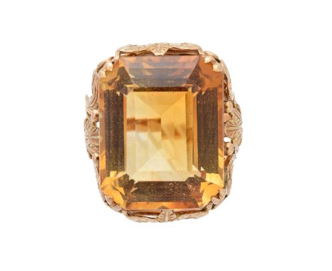 A citrine dress ring, the rectangular shape citrine within a foliate openwork setting, ring size L, gross weight 10g.Conditio