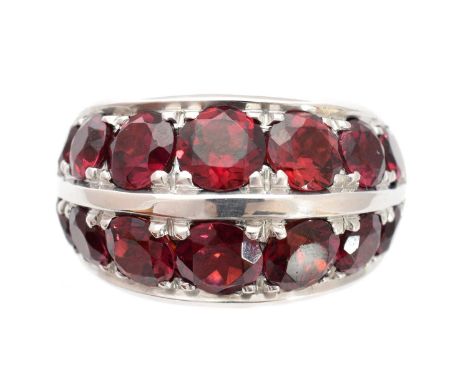 A garnet dress ring, designed as two circular shape garnet lines with raised bar sides, ring size I, gross weight 27.5g.Condi