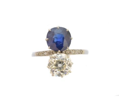 An early 20th century diamond and Basaltic sapphire toi et moi ring, the old cut diamond and cushion shape natural Basaltic n