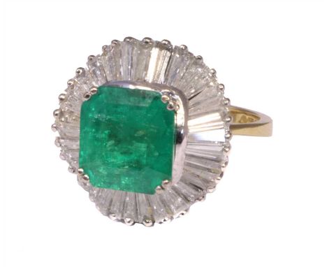 An 18ct gold emerald and diamond cluster ring, the square shape emerald weighing approximately 3.50cts within a tapered bague