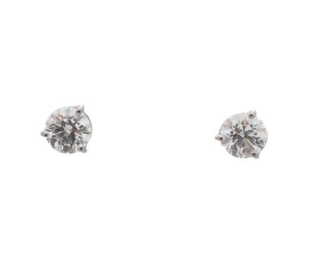 A pair of brilliant-cut diamond stud earrings, estimated total diamond weight 1.10cts, one with copy of GIA cert no. 12869888