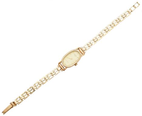 A 9ct gold ladies Rotary quartz watch, the oval signed dial with baton hour markers, within a 9ct gold case and fancy link br