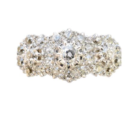 A diamond cluster ring, designed as a trio of old cut diamond clusters, estimated total diamond weight 1.30cts, stamped A.W.C