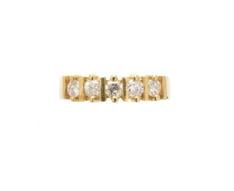 An 18ct gold diamond five stone ring, the brilliant cut diamond line with polished bar spacers, estimated total diamond weigh