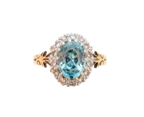 A zircon and diamond cluster ring, the oval shape zircon within a single cut diamond surround, estimated total diamond weight
