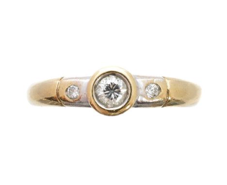 A 9ct gold diamond single-stone ring, of bicolour design, the brilliant-cut diamond with similarly cut diamond sides, estimat