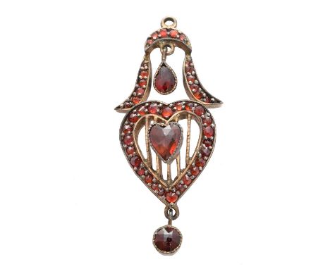 A Bohemian garnet pendant, the heart shape garnet within a circular shape garnet openwork surround, suspending pear shape and