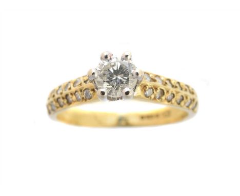 An 18ct gold diamond single stone ring, the brilliant cut diamond with pavé set diamond shoulders, estimated total diamond we