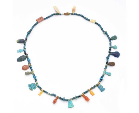 An Egyptian style faience bead necklace, later restrung, the discoid faience bead strand suspending further faience, ceramic 