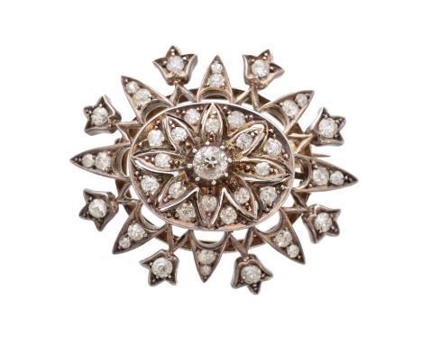 A 19th century diamond brooch, the old-cut diamond within a vari-cut diamond openwork surround, estimated total diamond weigh