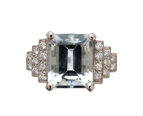 An aquamarine and diamond dress ring, the rectangular shape aquamarine with brilliant cut diamond stepped sides, estimated to