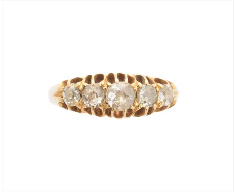 An 18ct gold diamond five stone ring, the graduated old cut diamond line with tapered shoulders, hallmarks for Birmingham, es