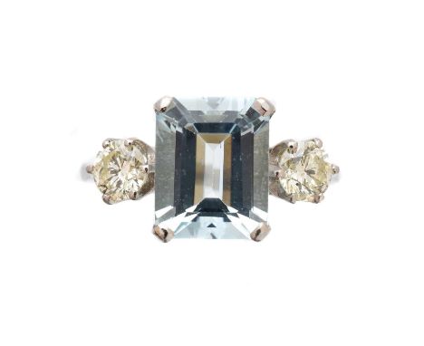 An aquamarine and diamond three stone ring, the rectangular shape aquamarine with brilliant-cut diamond sides, estimated tota