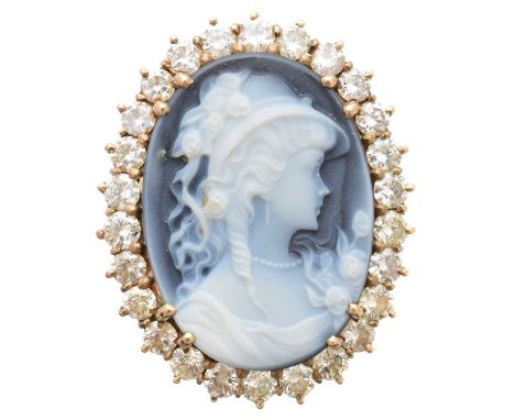 A 9ct gold shell cameo and diamond dress ring, the oval shell cameo within a brilliant-cut diamond surround, estimated total 