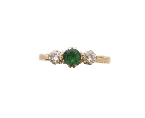 An 18ct gold emerald and diamond three stone ring, the circular shape emerald with brilliant cut diamond sides, estimated tot