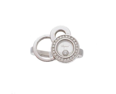 An 18ct gold diamond 'Happy Dreams' ring, by Chopard, of asymmetric design, the circular glazed panel containing a floating b
