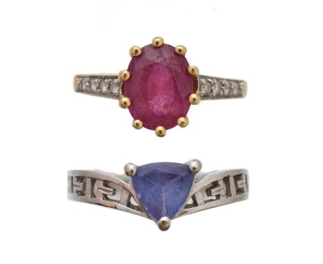 Two 18ct gold gem-set rings, to include a tanzanite single stone ring, together with a glass-filled ruby and diamond ring, es