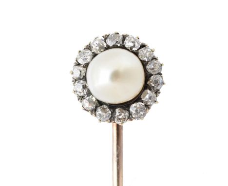 A natural saltwater pearl and diamond stickpin, the off-round natural saltwater pearl within an old cut diamond surround, est