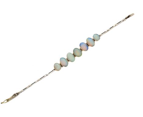 An opal bracelet, designed as a series of graduated oval opal cabochons, with fancy link chain sides and push-piece clasp, le