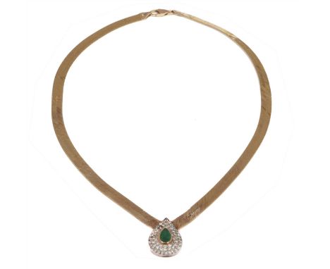 An 18ct gold emerald and diamond necklace, the pear shape emerald within a vari cut diamond surround, with fancy link chain s